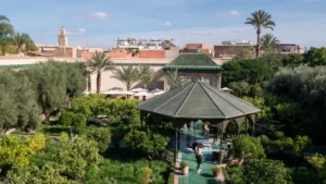 a gazebo in the middle of a lush green park