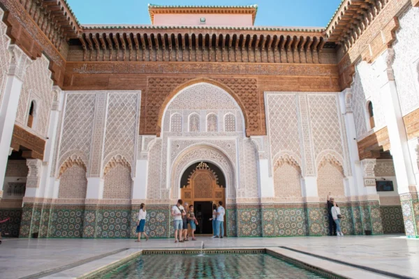 A group of people standing around a pool in a building
